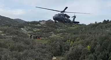 Dağlık alana düşen paraşütçüye jandarma helikopteriyle kurtarma