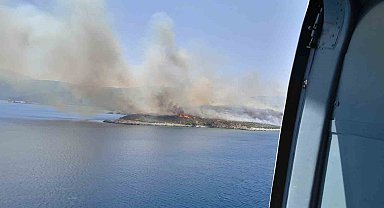 İzmir'de makilik alanda yangına havadan ve karadan müdahale